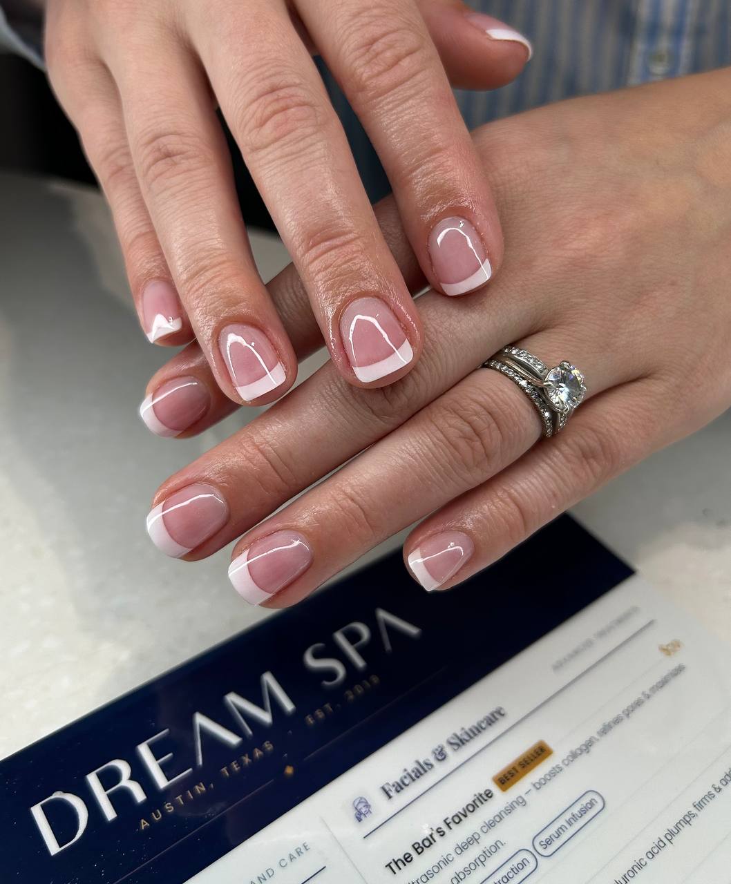 Short white tip French manicure with acrylic at Dream Spa Austin
