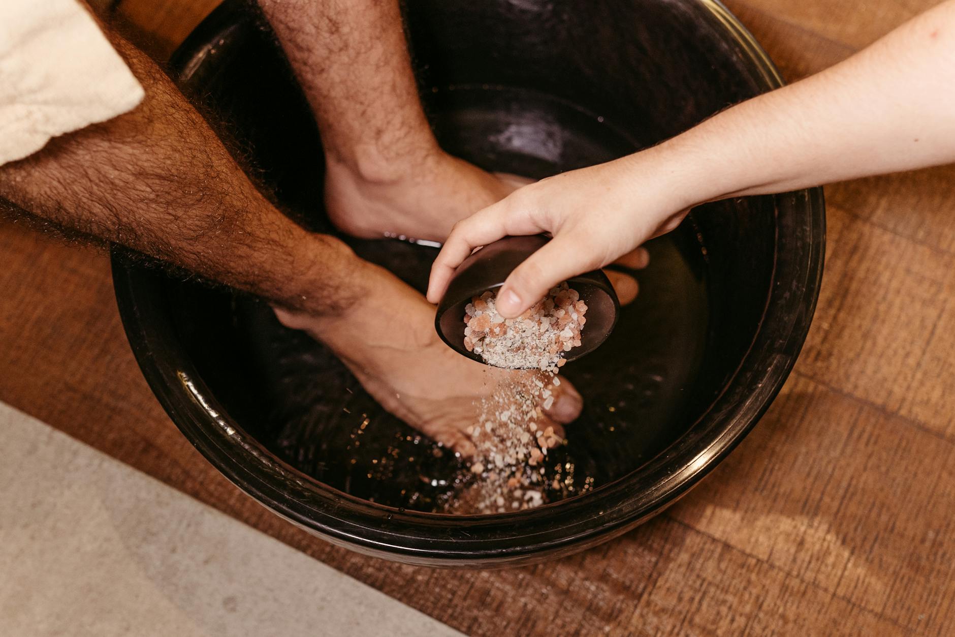 Foot soak bowl set up for at-home pedicure prep before a salon appointment